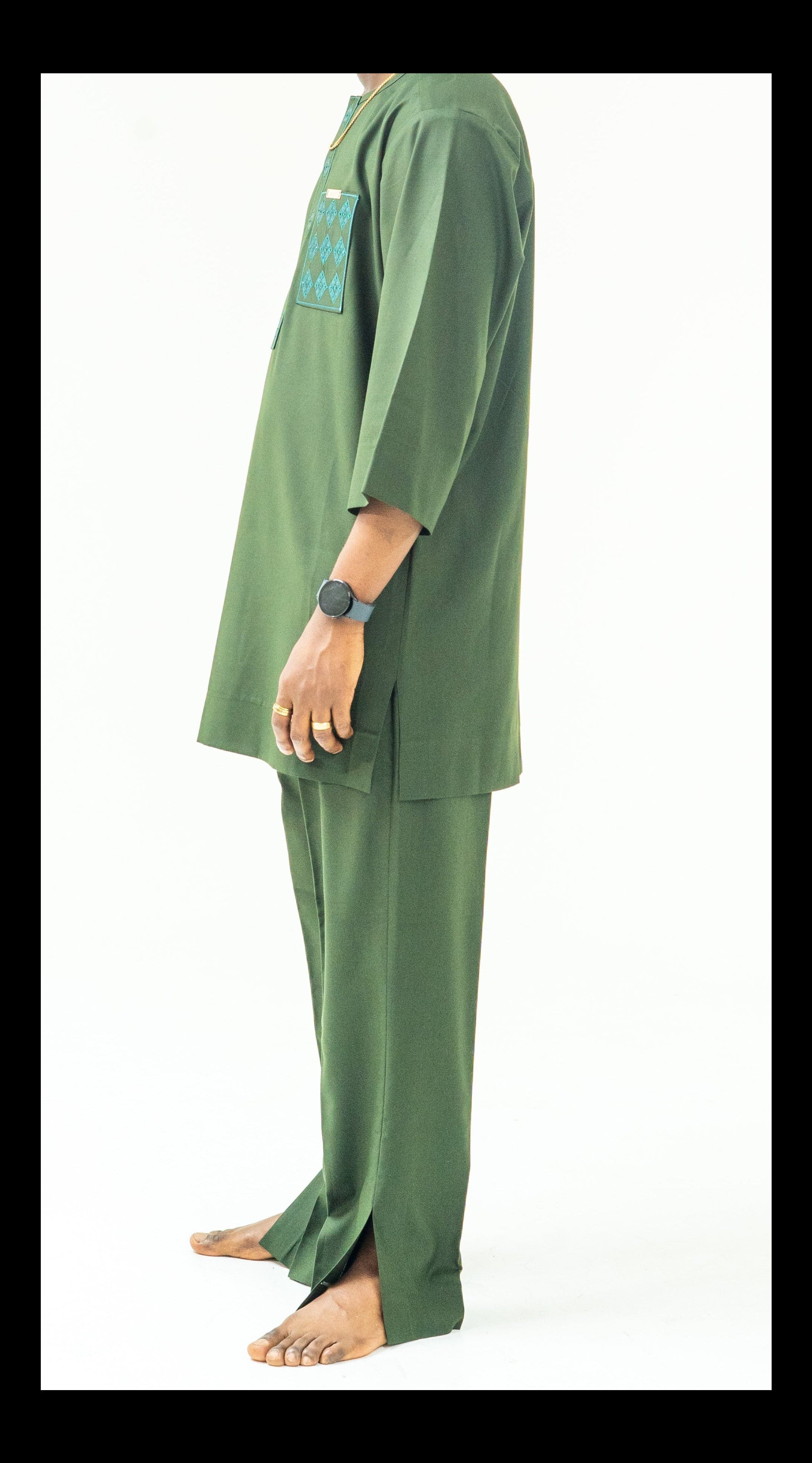 Person wearing a green outfit on a white background