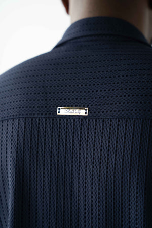 Luxury men's textured resort shirt in midnight navy with camp collar styling