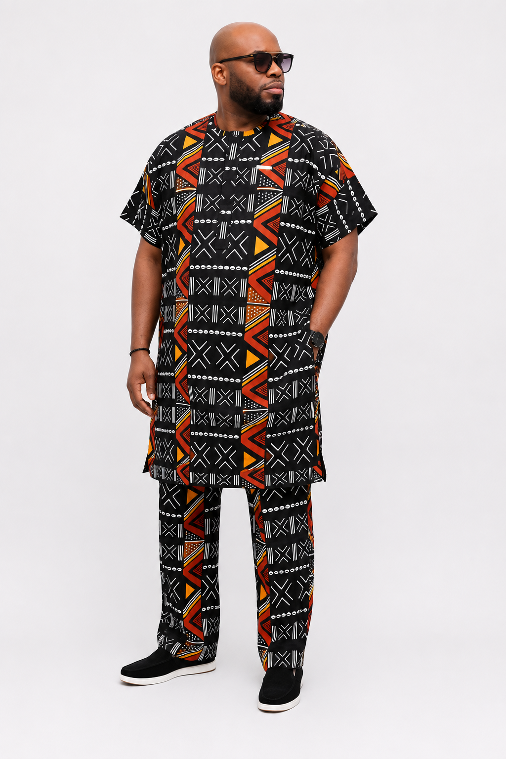 Front view of Baale Vogue black African men's danshiki set featuring bold geometric Ankara print with matching trousers, designed in London.