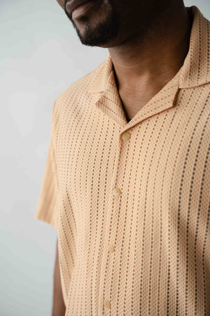 Close-up detail of textured knit fabric on men's resort shirt