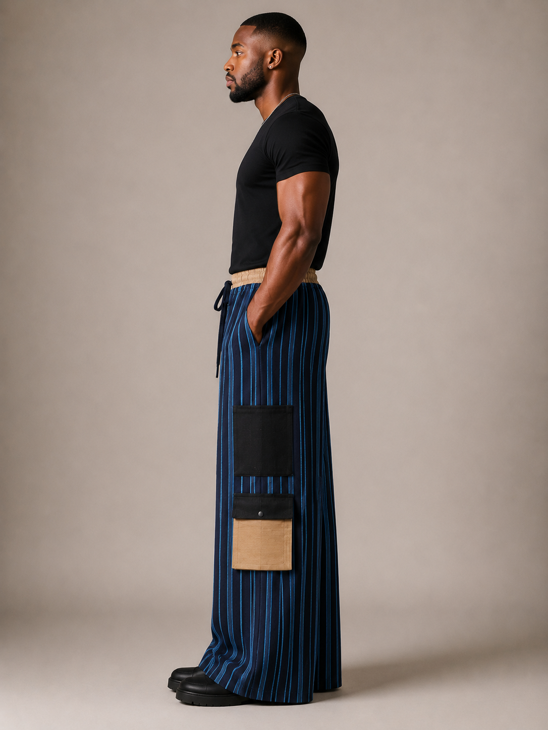 Side view of Akin luxury Aso Oke cargo trousers with oversized wide-leg silhouette