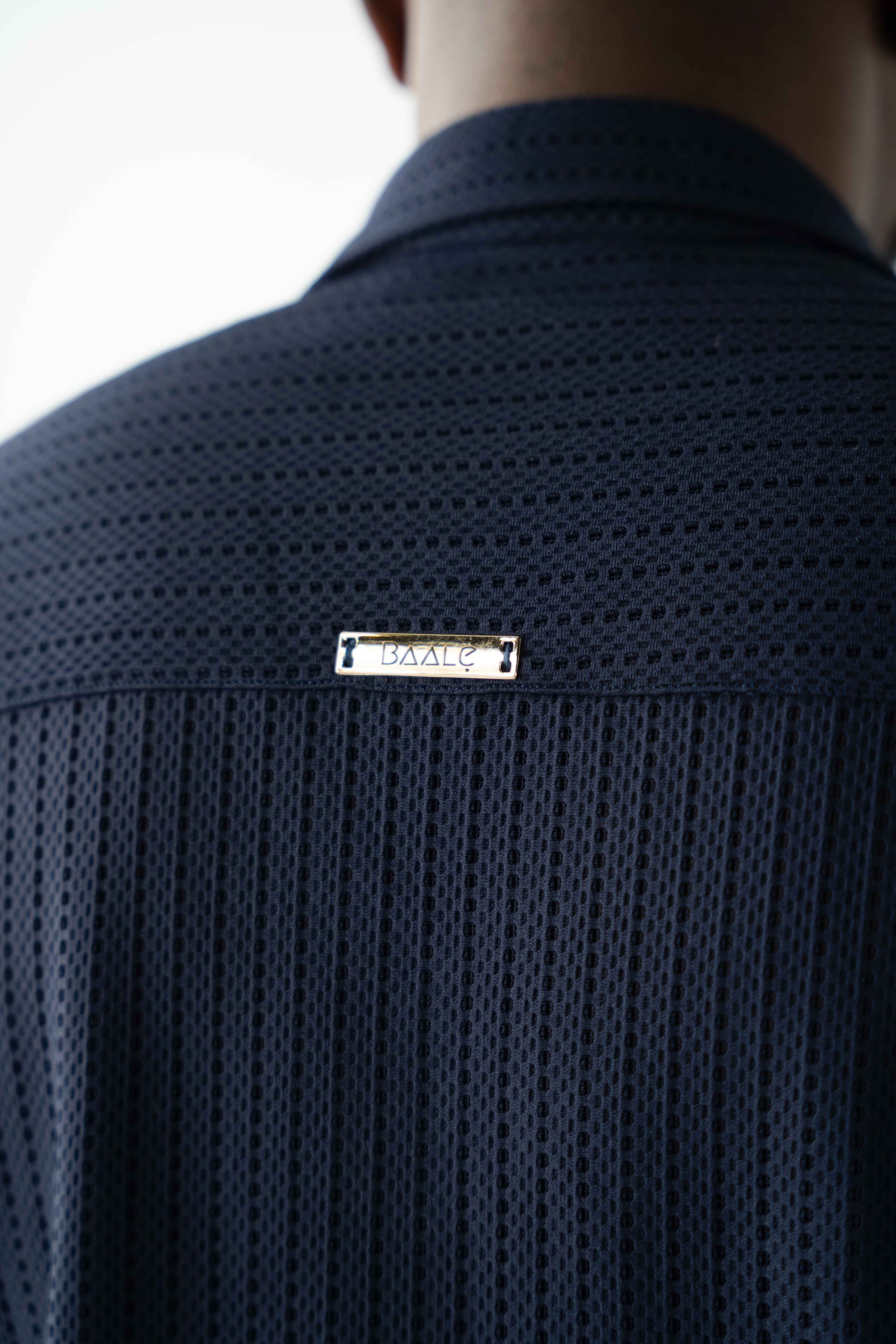 Luxury men's textured resort shirt in midnight navy with camp collar styling