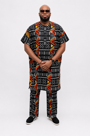 Three-quarter view of luxury black African print men's danshiki and trouser set by Baale Vogue, showcasing premium tailoring and geometric Ankara design.